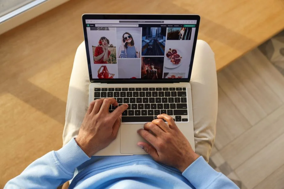 A miniature shopping cart placed on a laptop keyboard symbolizing online shopping and e-commerce.